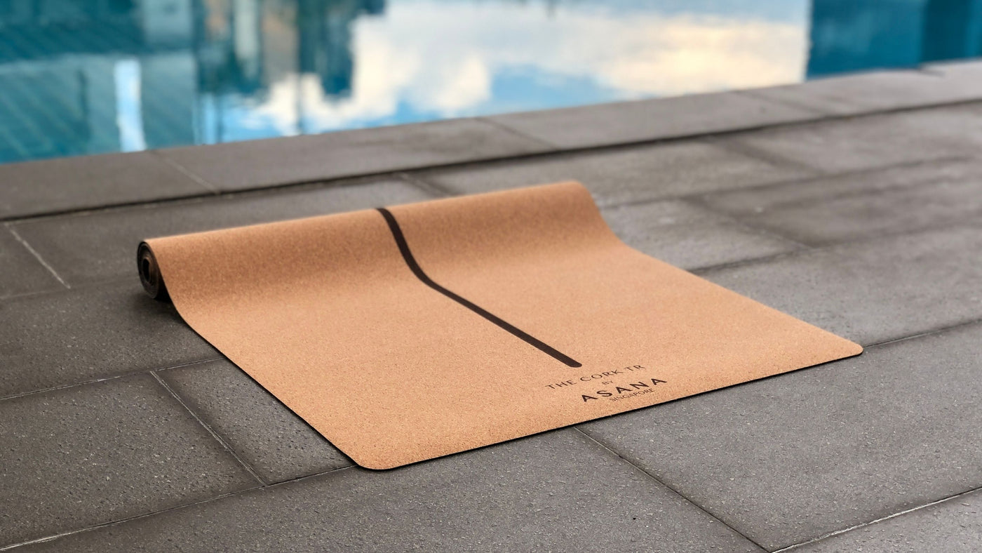 Cork TR Mat by Asana Singapore next to a swimming pool in Singapore