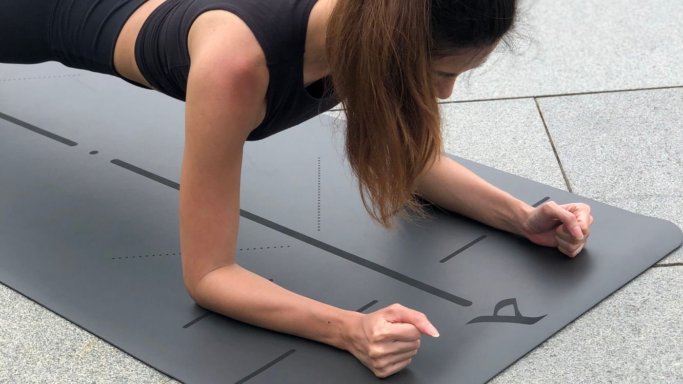 Fit Woman Planking on a Crow Pro Mat by Asana Singapore