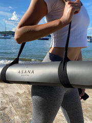 Fit Asian Woman Carrying The Crow Pro Ultimate Workout Mat With Strap by Asana Singapore