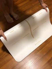 Woman Hands Demonstrating Sleek Material And Rolling Of The Sphinx Pro Ultimate Workout Mat by Asana Singapore