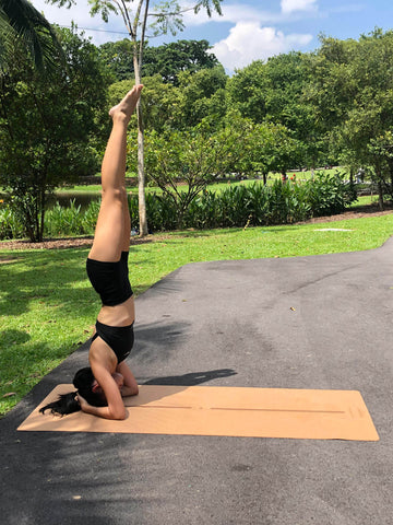 Woman Performing Yoga Headstand On The Cork TR Travel Yoga Mat by Asana Singapore