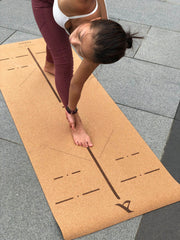 Woman Doing Yoga Pose On The Cork Pro Yoga Mat by Asana Singapore
