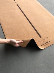 Womans Hand Demonstrating Thin Material Design Of The Cork TR Travel Yoga Mat by Asana Singapore
